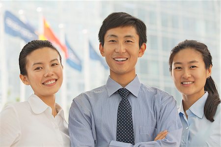 simsearch:6116-07086722,k - Portrait of three young business people, Beijing Stock Photo - Premium Royalty-Free, Code: 6116-07085295