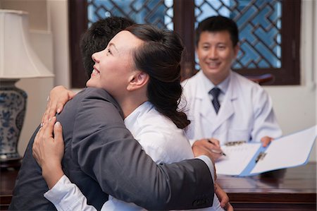relief (feeling better) - Patient and Spouse Hug at the Good News Stock Photo - Premium Royalty-Free, Code: 6116-07085661
