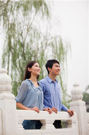 Young Couple on a Bridge Stock Photo - Premium Royalty-Free, Code: 6116-07085784