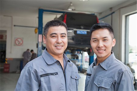 simsearch:6116-06938551,k - Portrait of Two Garage Mechanics Photographie de stock - Premium Libres de Droits, Code: 6116-07085733