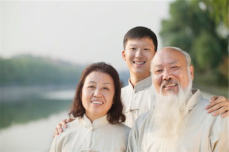 simsearch:6116-06939046,k - Three Chinese People With Tai Ji Clothes Smiling At Camera Photographie de stock - Premium Libres de Droits, Code: 6116-07085850