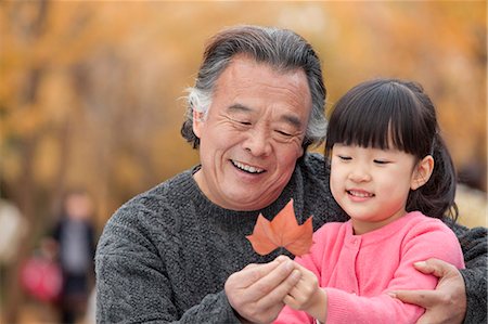 Grandfather and granddaughter in park Stock Photo - Premium Royalty-Free, Code: 6116-07086068