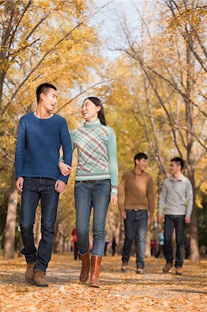 simsearch:6116-06939237,k - Friends walking together in park Stock Photo - Premium Royalty-Free, Code: 6116-07086073