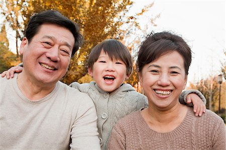 simsearch:6116-08311918,k - Portrait of Grandparents and Grandson in the Park Stock Photo - Premium Royalty-Free, Code: 6116-07086097