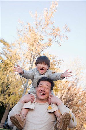 simsearch:6116-07084667,k - Grandfather and Grandson Playing in the Park Photographie de stock - Premium Libres de Droits, Code: 6116-07086094