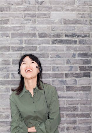simsearch:6116-07084961,k - Portrait of Young Woman Laughing Foto de stock - Sin royalties Premium, Código: 6116-07086247