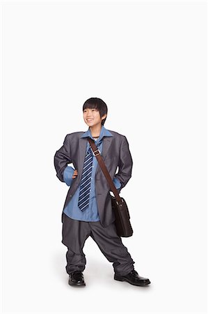 Boy dressed up as businessman Foto de stock - Sin royalties Premium, Código: 6116-07086269