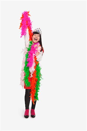 dressed up - Girl wearing feather boas and tiara Stock Photo - Premium Royalty-Free, Code: 6116-07086273