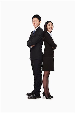 full body series of woman white background - Businessman and businesswomen standing back to back Stock Photo - Premium Royalty-Free, Code: 6116-07086297