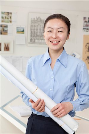 east asian meeting office - Businesswoman standing with stuck of papers in the office, portrait Stock Photo - Premium Royalty-Free, Code: 6116-07086200