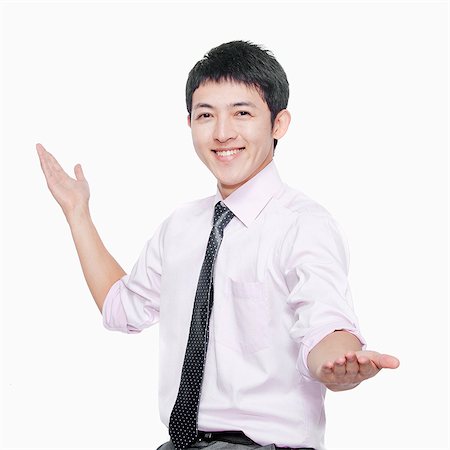 simsearch:6116-07086332,k - Young man smiling with arms outstretched Stock Photo - Premium Royalty-Free, Code: 6116-07086351