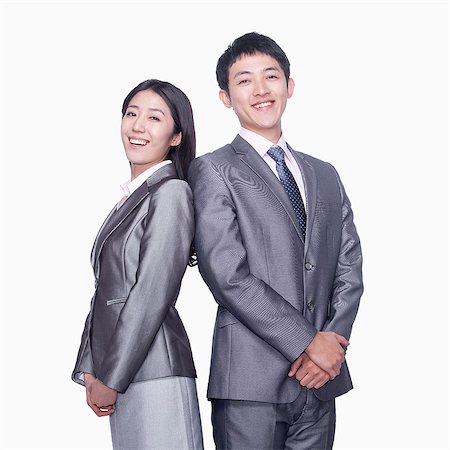 simsearch:6116-07086332,k - Businessman and businesswoman standing back to back Stock Photo - Premium Royalty-Free, Code: 6116-07086361
