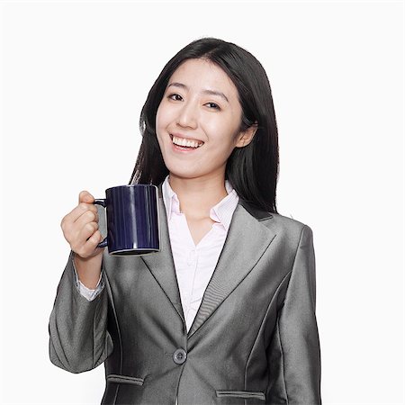 simsearch:6116-07086332,k - Businesswoman with coffee mug Stock Photo - Premium Royalty-Free, Code: 6116-07086377