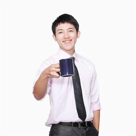 simsearch:6116-07086332,k - Businessman with coffee mug Stock Photo - Premium Royalty-Free, Code: 6116-07086376