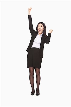 smile look at camera studioshot one person - Businesswoman cheering Stock Photo - Premium Royalty-Free, Code: 6116-07086330