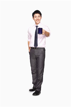 simsearch:6116-07086332,k - Businessman smiling with mug Stock Photo - Premium Royalty-Free, Code: 6116-07086337