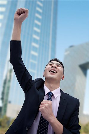 excited, arms up - Businessman Cheering Stock Photo - Premium Royalty-Free, Code: 6116-07086451