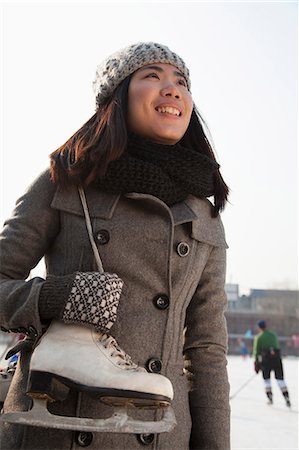 simsearch:6116-07086581,k - Young woman ice skating portrait, Beijing Stock Photo - Premium Royalty-Free, Code: 6116-07086493