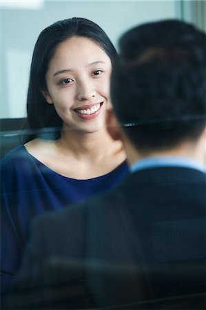 simsearch:6116-07086518,k - Two co-workers talking in office Stock Photo - Premium Royalty-Free, Code: 6116-07086497