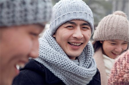 simsearch:6116-07086425,k - Portrait of Young Man in Winter with Friends Stock Photo - Premium Royalty-Free, Code: 6116-07086404