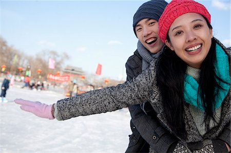 snow ice - Young couple at ice rink Stock Photo - Premium Royalty-Free, Code: 6116-07086575