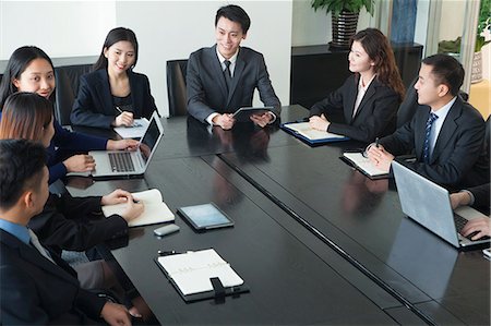 simsearch:6116-06938885,k - Business people having meeting Stock Photo - Premium Royalty-Free, Code: 6116-07086513