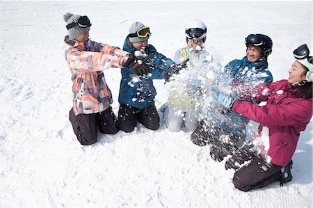 simsearch:6116-07086425,k - Group of People Playing in the Snow in Ski Resort Stock Photo - Premium Royalty-Free, Code: 6116-07086607