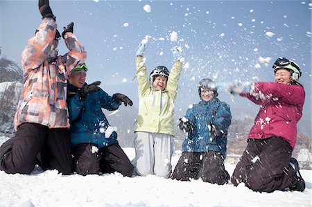 simsearch:6115-06966977,k - Group of People Playing in the Snow in Ski Resort Stock Photo - Premium Royalty-Free, Code: 6116-07086606