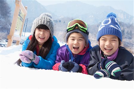 simsearch:6116-07086571,k - Children Lying on the Snow Stock Photo - Premium Royalty-Free, Code: 6116-07086616