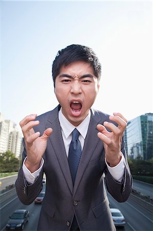 simsearch:6116-07235392,k - Young Angry Businessman Yelling Foto de stock - Royalty Free Premium, Número: 6116-07235384