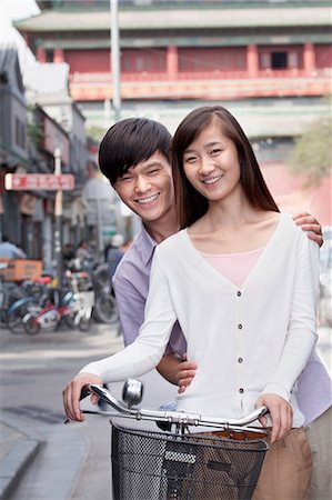 Young Heterosexual Couple on a Bicycle in Beijing Stock Photo - Premium Royalty-Free, Code: 6116-07235323