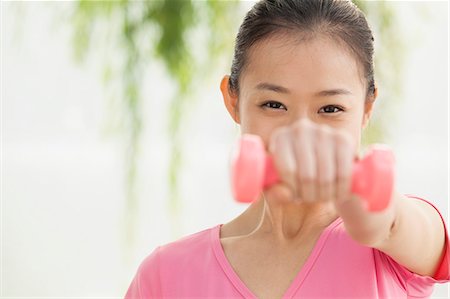 Young woman exercise in the park Stock Photo - Premium Royalty-Free, Code: 6116-07235412