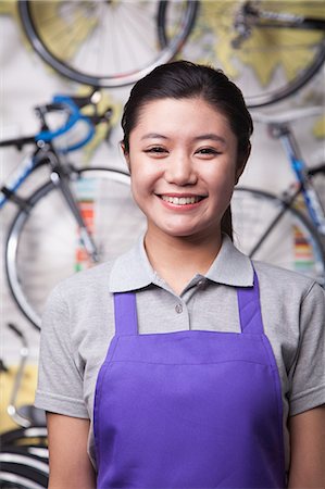 simsearch:6116-06938959,k - Portrait of young female mechanic in bicycle store, Beijing Stock Photo - Premium Royalty-Free, Code: 6116-07235574