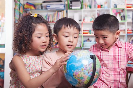 education ideas - Students Looking at a Globe Stock Photo - Premium Royalty-Free, Code: 6116-07235597