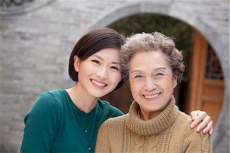 simsearch:6116-07235528,k - Grandmother and granddaughter in front of round arch, Beijing Stock Photo - Premium Royalty-Free, Code: 6116-07235531