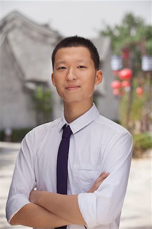 simsearch:6116-07235632,k - Young Man smiling and looking at camera Stock Photo - Premium Royalty-Free, Code: 6116-07235644