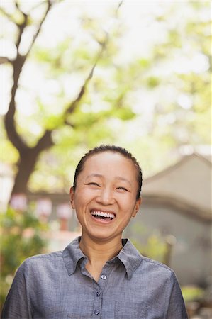 simsearch:6116-07235632,k - Young Woman smiling and looking at camera Stock Photo - Premium Royalty-Free, Code: 6116-07235646