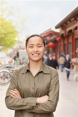 simsearch:6116-07235632,k - Young Woman smiling and looking at camera Stock Photo - Premium Royalty-Free, Code: 6116-07235651