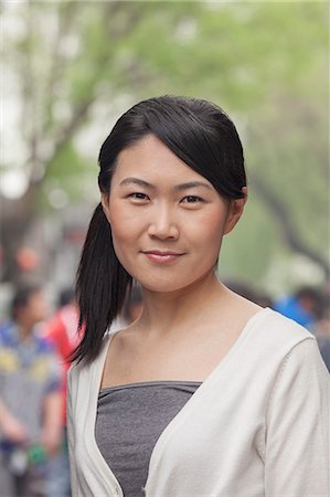 simsearch:6116-07235632,k - Young Woman smiling looking at camera Stock Photo - Premium Royalty-Free, Code: 6116-07235630