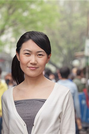 simsearch:6116-07235632,k - Young Woman smiling looking at camera Stock Photo - Premium Royalty-Free, Code: 6116-07235631