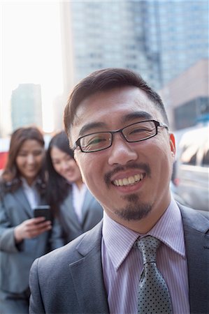 simsearch:6116-07236380,k - Portrait of smiling businessman outdoors, Beijing Stock Photo - Premium Royalty-Free, Code: 6116-07235743