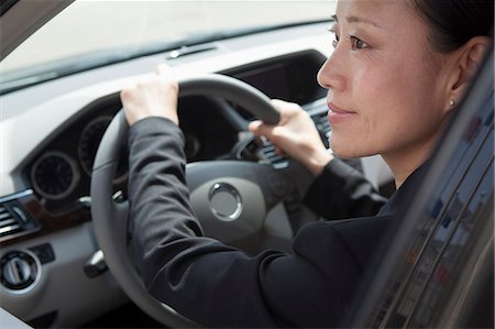 flags business - Mature businesswomen driving car. Stock Photo - Premium Royalty-Free, Code: 6116-07235813