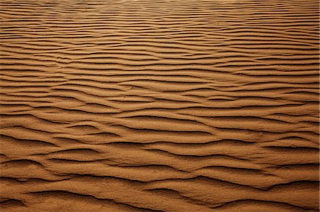 simsearch:614-02985457,k - Texture background of wind pattern on sand dunes, full frame Stock Photo - Premium Royalty-Free, Code: 6116-07235942