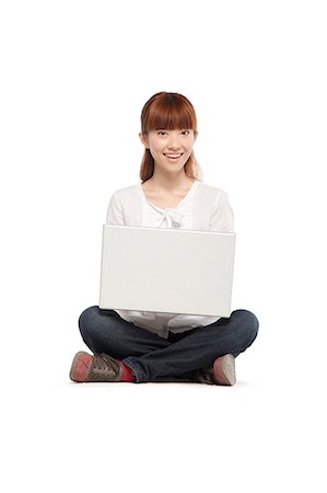 simsearch:649-08145358,k - Young woman using a laptop computer Stockbilder - Premium RF Lizenzfrei, Bildnummer: 6116-08311943