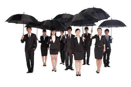 ethnic groups of east asia - A group of business people holding umbrella Stock Photo - Premium Royalty-Free, Code: 6116-08311959