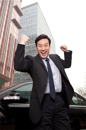 Businessman expressing enthusiasm Stock Photo - Premium Royalty-Free, Code: 6116-08311999