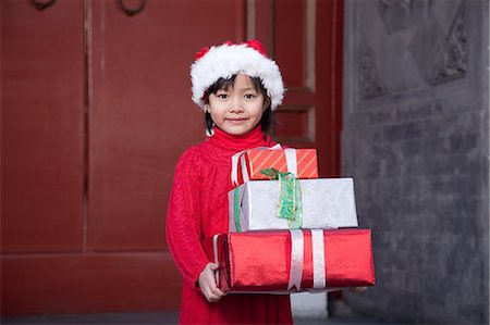 simsearch:6116-08311918,k - Girl Holding Christmas Gifts Stock Photo - Premium Royalty-Free, Code: 6116-08311914