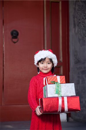 simsearch:6116-08311918,k - Girl Holding Christmas Gifts Stock Photo - Premium Royalty-Free, Code: 6116-08311915