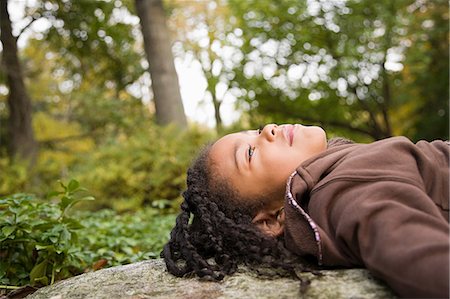 photography of little girl dreaming - Girl in a forest Stock Photo - Premium Royalty-Free, Code: 6116-08945516