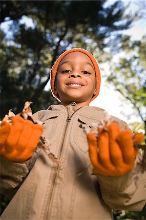 Boy with leaves Stock Photo - Premium Royalty-Free, Code: 6116-08945524
